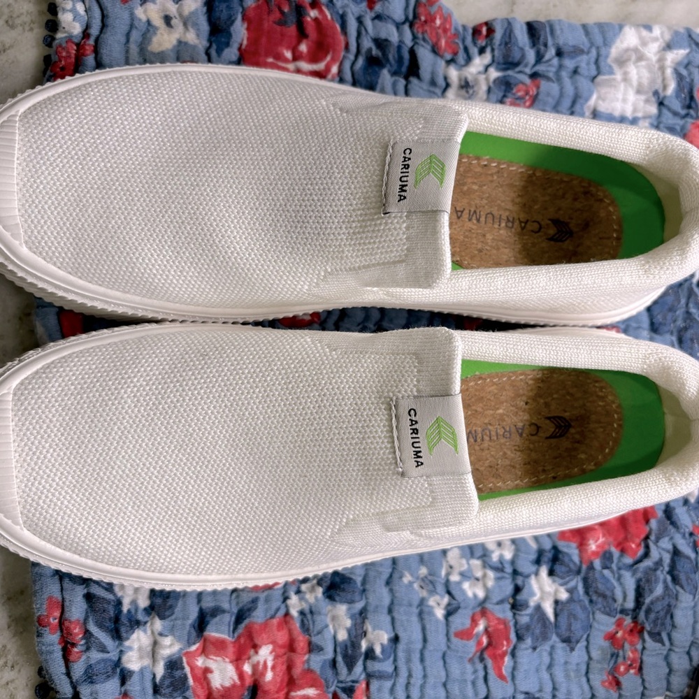 Women’s size 7 knit Cariuma slip on shoes with cork insoles. Never worn.